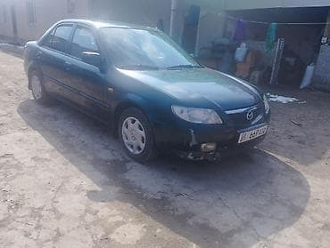4 5мм: Mazda 323: 2001 г., 1.6 л, Автомат, Бензин, Седан — 1