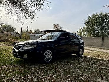 4 5мм: Mazda 323: 2002 г., 1.6 л, Механика, Бензин, Хетчбек — 3