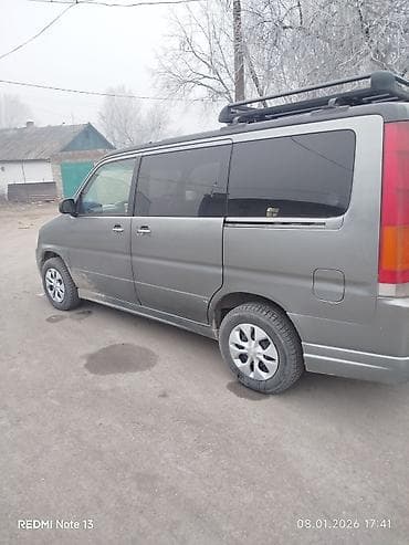 Минивэн/микроавтобус серого цвета. Основные особенности: - Кузов