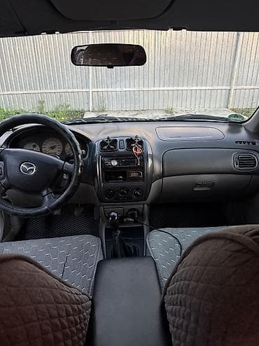 pes 2013: Mazda 323: 2003 г., 1.6 л, Механика, Бензин, Седан — 6