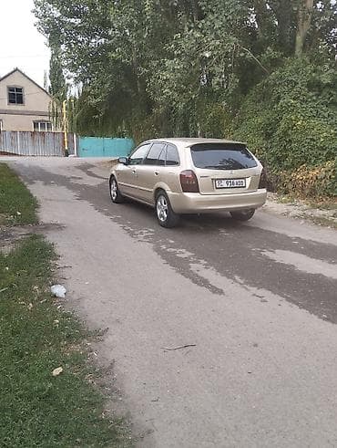 e2 byd: Mazda 323: 2002 г., 1.6 л, Механика, Бензин, Хэтчбэк — 4