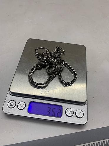 серебряный крестик: Серебряная цепочка Якорь. Вес цепочки составляет 35,2 грамма. Замок — 2