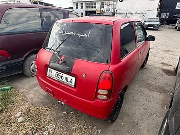 Daihatsu Cuore: 2001 г., 1 л, Механика, Бензин, Хэтчбэк — 5
