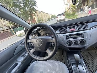 daewoo leganza: Mitsubishi Lancer-2003, объем 2. Седан компакт-класса, темно-синего — 5