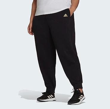 ADIDAS. Теплые спортивные штаны Essentials с золотым логотипом.Мягкий