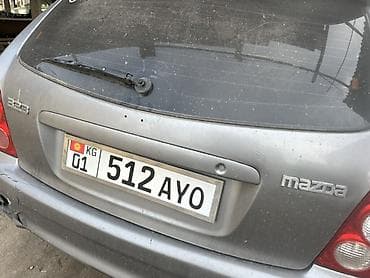Mazda 323: 2002 г., Хетчбек