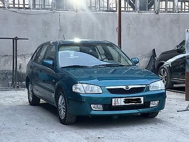 Mazda 323: 1999 г., 1.5 л, Автомат, Бензин, Хэтчбэк — 1