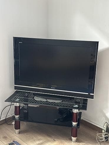 psp system: Телевизор Sony Bravia с плоским экраном на стеклянной тумбе. Основные — 1
