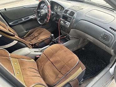 golf variant: Mazda 323: 2002 г., 1.6 л, Механика, Бензин, Седан — 9