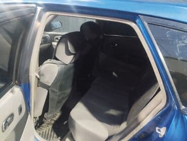 авто пулт: Mazda 323: 2001 г., Бензин, Хэтчбэк — 6