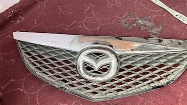 Решетка радиатора Mazda 2004 г., Оригинал