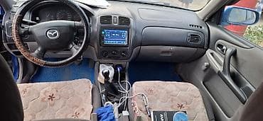 Mazda 323: 2002 г., Механика, Бензин, Хэтчбэк — 8