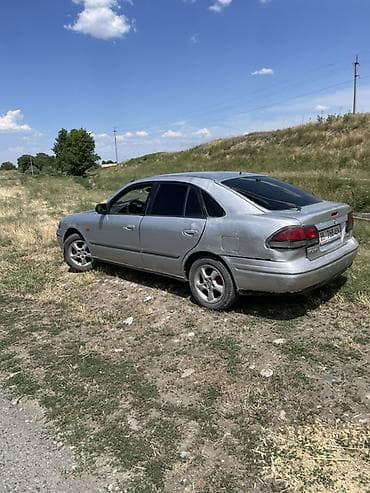газ 69: Mazda 626: 1999 г., 1.8 л, Бензин, Седан — 7