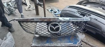 решетка на дверь: Решетка радиатора Mazda Оригинал — 2
