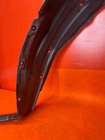 гофрированная бумага купить: Черный пластиковый подкрылок для автомобиля. Имеет изогнутую форму — 4