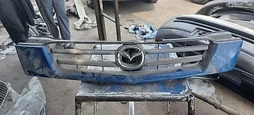 решетка на дверь: Решетка радиатора Mazda Оригинал — 6