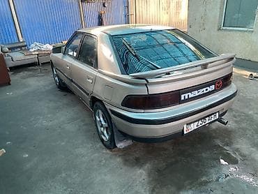 Mazda 323: 1991 г., 1.8 л, Механика, Бензин, Лифтбек — 7