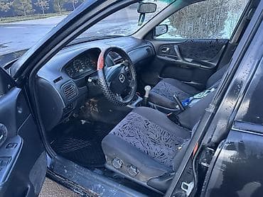 срочно мазда: Mazda 323: 2000 г., 1.8 л, Механика, Бензин, Универсал — 8