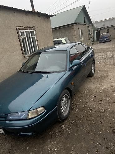 кулиса на 210: Mazda 626: 1992 г., 2 л, Механика, Бензин, Хэтчбэк — 4