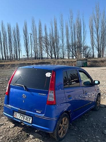 golf 2: Daihatsu Cuore: 2003 г., Автомат, Бензин, Хэтчбэк — 10