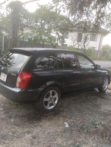 6: Mazda Familia: 2003 г., 1.6 л, Механика, Бензин, Универсал — 3