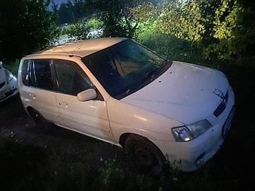 gac aion v: Mazda Demio: 2001 г., 1.3 л, Автомат, Бензин, Универсал — 4