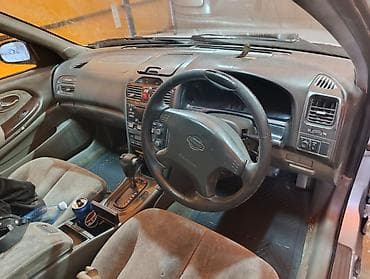 вариант: Nissan Cefiro: 2000 г., 2 л, Автомат, Бензин, Седан — 5