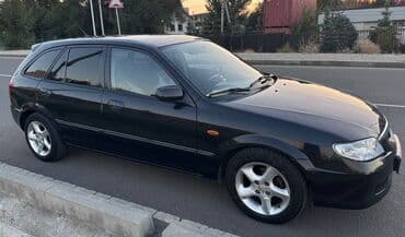 полик нексия 2: Mazda 323: 2002 г., Механика, Универсал — 3