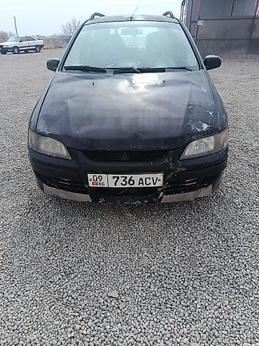 салон машины: Mitsubishi Space Star: 2003 г., 1.3 л, Механика, Бензин, Хэтчбэк — 5