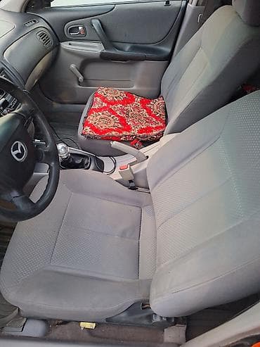 mazda 626 1998: Mazda 323: 2002 г., 1.3 л, Механика, Бензин, Универсал — 7