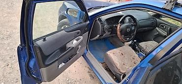Mazda 323: 2002 г., Механика, Бензин, Хэтчбэк — 6