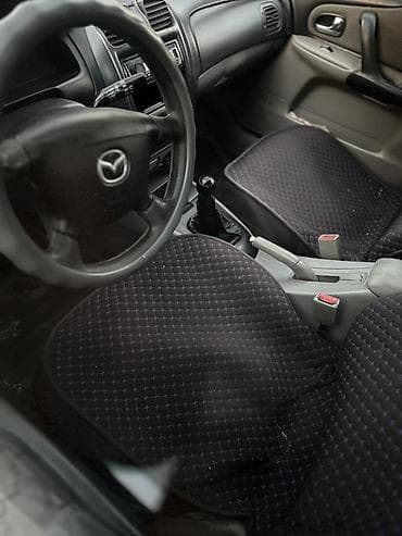 Продажа авто: Mazda Familia: 2002 г., 1.6 л, Механика, Бензин, Хэтчбэк — 4
