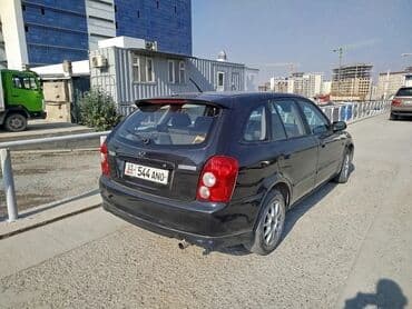 полик нексия 2: Mazda 323: 2003 г., Механика, Бензиновая, Универсал — 2