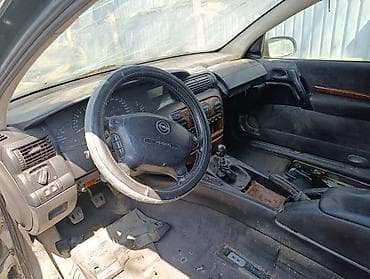 катуша: Opel Omega B, серебристый седан — разбор по запчастям Доступны — 2