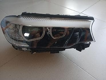 Автозапчасти: Передняя фара в сборе для BMW (левая сторона). Характеристики: - Тип — 2