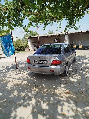 чери арризо 8 салон: Mitsubishi Lancer: 2006 г., Седан — 6