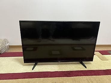 smart box: Телевизор LG, диагональ около 40–43". Узкие рамки, ножки-подставки по — 1