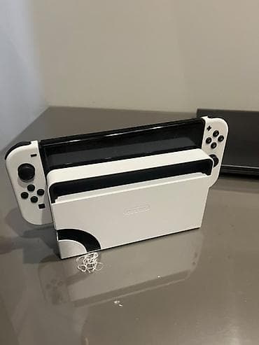 Nintendo Switch OLED: Nintendo Switch OLED (модель HEG-001) — белая версия Комплектация по — 4