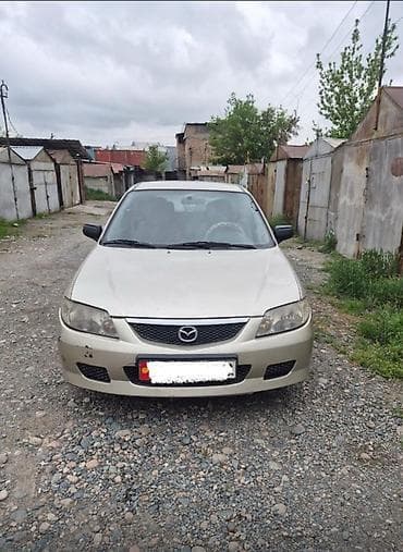 lada 2105: Mazda Familia: 2002 г., 1.3 л, Механика, Бензин, Универсал — 1