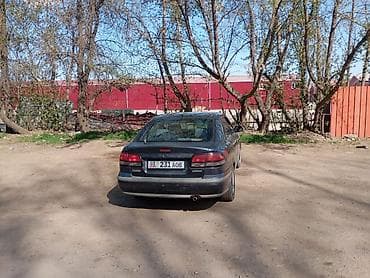 глушитель насадка: Mazda 626: 1997 г., 2 л, Ручные, Бензин, Хэтчбэк — 1