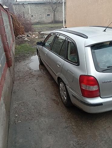 x5 e53: Mazda 323: 2000 г., 1.5 л, Механика, Бензин, Универсал — 2