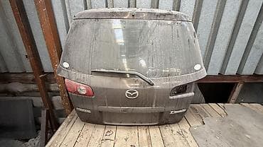 демио пороги: Крышка багажника Mazda, Оригинал — 1