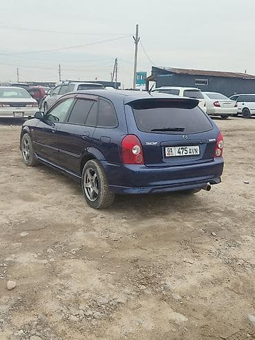 bme e34: Mazda Familia: 2002 г., 1.6 л, Ручные, Универсал — 5