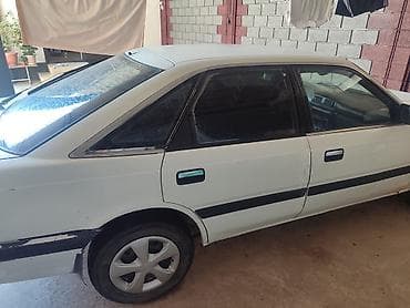 Mazda 626: 1989 г., 2 л, Кол менен иштөөчү, Седан — 1