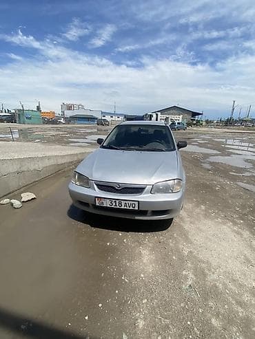 простой: Mazda 323: 2000 г., 1.6 л, Автомат, Бензин, Седан — 1