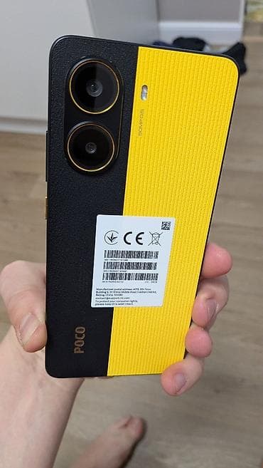 POCO X7 pro 12-256 – смартфона в фирменной желто‑черной расцветке