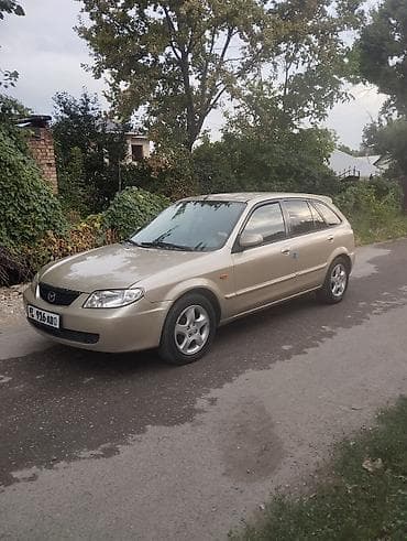 e2 byd: Mazda 323: 2002 г., 1.6 л, Механика, Бензин, Хэтчбэк — 3