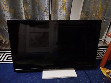 Телевизор VASIN, диагональ примерно 32–40". Классический черный