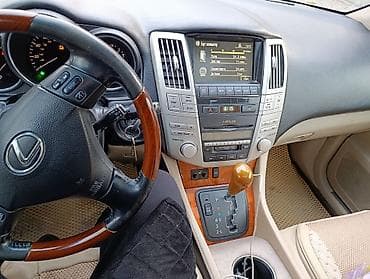 Детали салона: Lexus RX 330) — интерьер и оснащение - Рулевое колесо с — 1