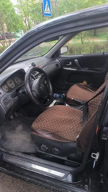 Mazda 323: 2003 г., 2 л, Механика, Газ, Универсал
